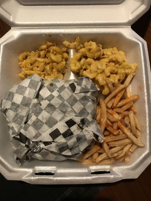 Side of Mac! Buffalo chik’n sandwich wrapped up, comes with fries!  at Planet Vegan in Houston