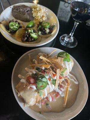 Chicken and Rice Chimichanga and Garlic Carne Asada Tacos with house Cabernet.   at Casa Del Vegano in Dallas