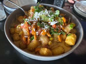 Large Totchos topped with Elotes (GF) at Casa Del Vegano in Dallas