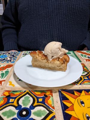 Hot vegan apple cake with vegan ice cream at Olive Grove Bistro in Worksop