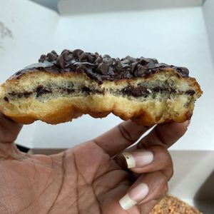 Inside of chocolate donut topped with chocolate chips at Jenny's Donuts in Redlands