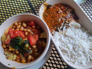 Samosa with toppings and main course dish at Chat Junction in Berlin