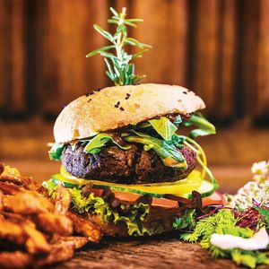 Our signature Burger:
The Black Bean Burger consists of our homemade burger bun and Black Bean Patty as well as fresh and regional vegetables.On side there are crispy french fries. at Hotel Gasthof Brüggler in Radstadt