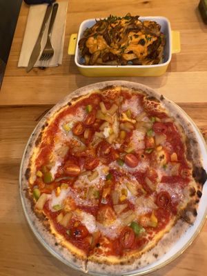 Hawaiian pizza and poutine   at Chutnej in Prague