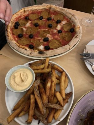 Pizza pepperoni with olives and a side fries  at Chutnej in Prague