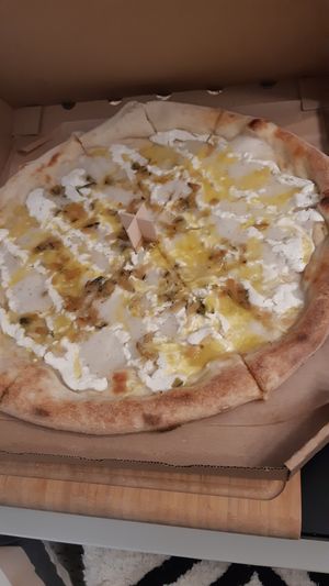 Four cheese pizza take out at Chutnej in Prague