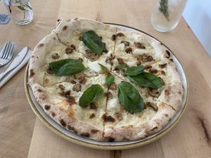 Pizza "bianca" with a lentil base, mushrooms and basil  at Chutnej in Prague