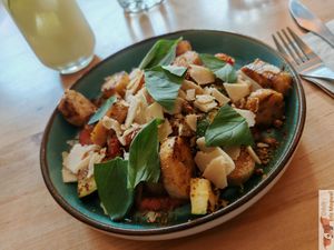 Baked potatoe gnocchi, tomato Almond pesto, zucchini, pistachios, "parmesan" from Rysama at Chutnej in Prague