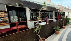 Nice to seat outside with shadow in a quiet street without people walking at Restaurante Indian Grill House in Costa Da Caparica