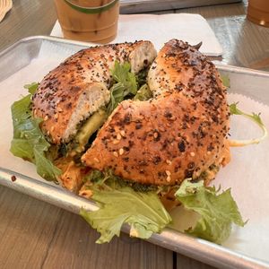 Wow! This vegan bagel with pesto, greens and peppers was delicious, as was the vegan Carmel coconut milk iced latte!  at Paia Bay Coffee in Paia