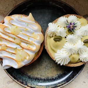 Freshly picked-up pastries: on the left “citron meringue” and on the right the brand new “ganache pistache et crème diplomate”.  at Reed in Luxembourg City