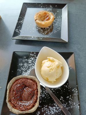 Top: pastel del nata. Bottom: lava cake at Reed in Luxembourg City