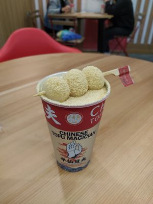 Soy milk with jasmine tea, dango and soy powder on top at Chinese Tofu Magician in Barcelona