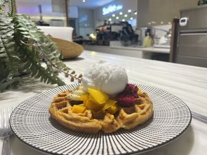 Tropical waffle with supermarket in the background   at Oatberry Cafe - Scotts Square in Central Singapore