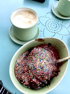 vegan dark choclate spaghetti style ice cream w/ sprinkles & coffee w/ oat milk 🍨 at Eislust in Kassel