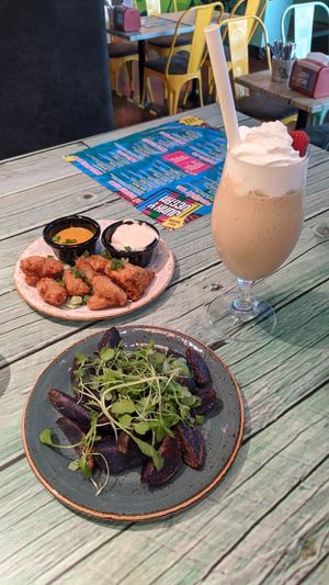 No chik, blue wedges with garlic dip, and salty licorice milkshake at Junk y Vegan in Helsinki