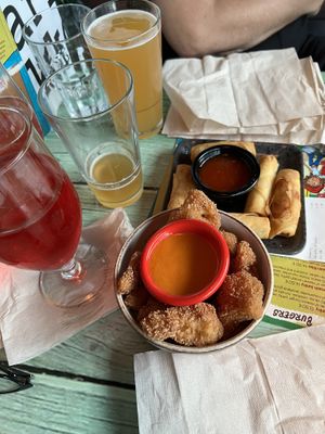 Cauliflower bites with hot sauce and spring rolls. Yum!  at Junk y Vegan in Helsinki