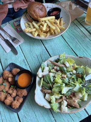 Cauliflower bites with hot sauce, Caesar salad, and portobello burger    at Junk y Vegan in Helsinki