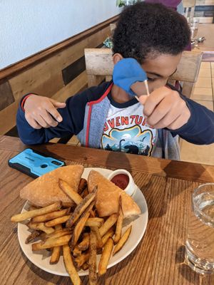 Nashville Hot Chicken with fries at Yummvees in Richmond