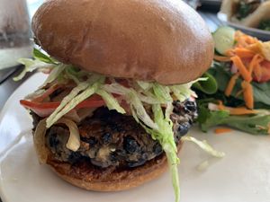 Bacon and cheese burger with house salad. The croutons! 🤩🤩🤩 The bean and grain burger is amazing!  at Yummvees in Richmond
