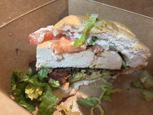 The “Chicken Ranch” sandwich half gone (forgot to photograph before I started eating)!  at Yummvees in Richmond