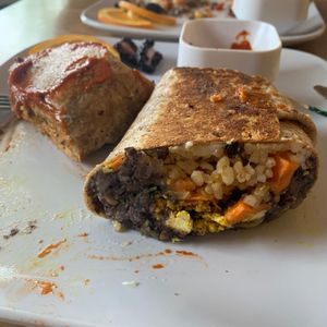 Vegan burrito half eaten 😋 at Communitea Cafe in Canmore