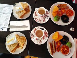 Full English breakfast with oat latte. at The Music Cafe in Stratford-upon-avon