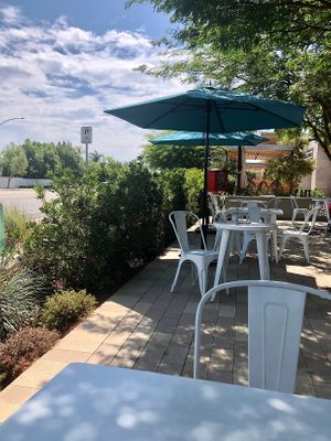 Outdoor seating with a mini library. 📚 at Copa Vida in San Diego