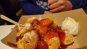 Cloudberry mini pancakes with warm strawberry sauce (and gold dust) at Coconut Whisk in Minneapolis
