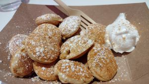 Classic mini pancakes with powdered sugar and gold dust at Coconut Whisk in Minneapolis