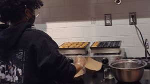 Making the mini pancakes at Coconut Whisk in Minneapolis