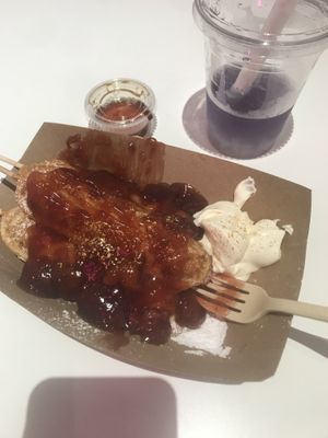 Waffles with straw and cream SO YUM and iced sweetened butterfly pea flower tea with coconut jellies, oh my gosh so good at Coconut Whisk in Minneapolis