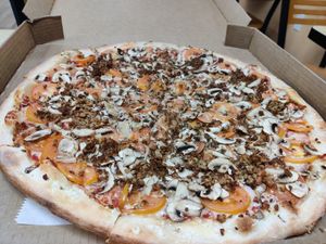 Vegan cheese, tomatoes, meatless crumbles, mushrooms at M3 Pizza in Southside Place