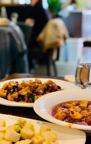 Top left: Gong Bao King Oyster Mushroom, right: Mapo Tofu, bottom left: deep fried tofu with salt and pepper.  at Tofu Vegan - Islington in North London