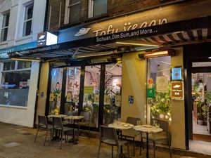 Exterior with some outside tables at Tofu Vegan - Islington in North London