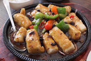 Sizzling fried tofu in a black bean sauce. 
I’d suggest a side of rice with this. at Tofu Vegan - Islington in North London