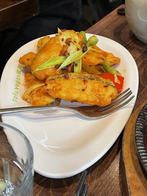 Twice cooked fish. Separately sold bao buns with sauce as their speciality dish are available  at Tofu Vegan - Islington in North London