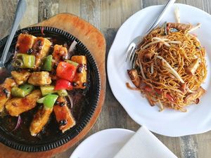 Sizzling tofu in black bean sauce and fried noodles with tofu at Tofu Vegan - Islington in North London