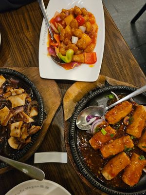 Sweet and sour chicken (top). Oyster mushroom in black pepper sauce (left). Sizzling tofu in house sauce (right). at Tofu Vegan - Islington in North London