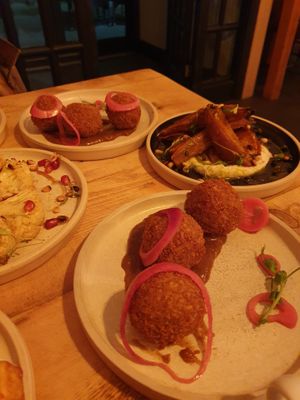 Arancini with katsu sauce, cauliflower in tahini sauce and ral el hanout sweet potatoes at Vegan Tapas in Heswall