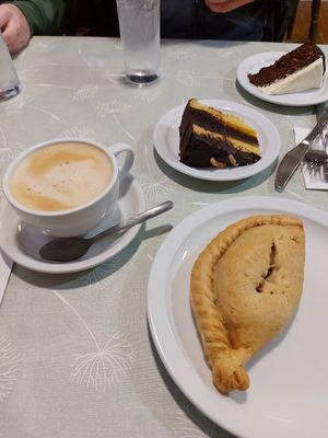 Vg pasty, choc orange cake and oat milk latte at Market Place Cafe in Wells