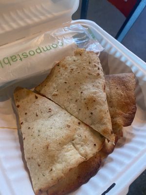 Vegan quesadilla (takeout)  at Curiosity Coffee Bar in Columbia