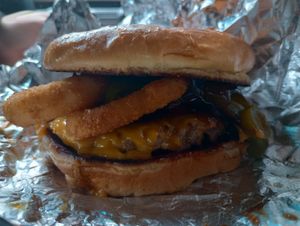 Bilbo-Q burger: cheese, onion rings, pickled jalapeno peppers, bbq sauce, potato bun at Wizard Burger in Albany
