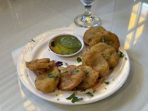 Aloo (potato) pakoras with cilantro chutney and tamarind   at Saffron Grill in Seattle