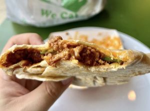Original Crane Crunchwrap (seasoned beef, refried beans, house made cheese sauce, lettuce, tomato, and sour cream)  at Take Two Cafe in Schenectady