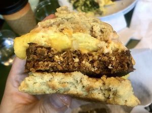 James Dean (home made biscuit with sausage, cheddar cheese, Just egg, and sriracha maple mayo)  at Take Two Cafe in Schenectady