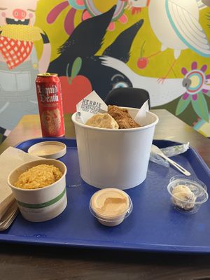 A “small” bucket with some sparkling watermelon water   at Herbie Butcher's Fried Chicken in Minneapolis