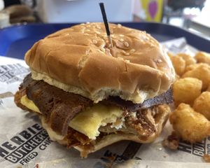 Dragon Dusted Chicken with JUST Egg, mayo, HB queso, and 2 strips HB bacon. Really tasty💚  at Herbie Butcher's Fried Chicken in Minneapolis