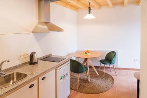 Kitchen and Living room apartment at O Viso Ecovillage in Ourol