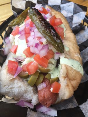 Green olives with basil dressing and chile serrano. at Perro Rojo in Guadalajara